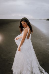 An Ivory embroidered Bespoke Wedding dress gown made with metres of tulle and a hand stitch feather lace bodice